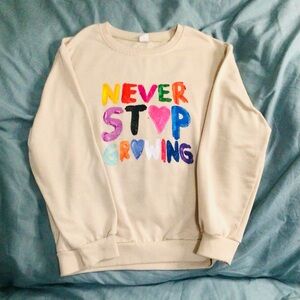 SHEIN Cream Sweatshirt with Colorful Graphic